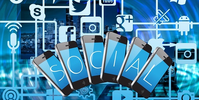 Picture of social media icons with the word social spelled out on smartphone screens