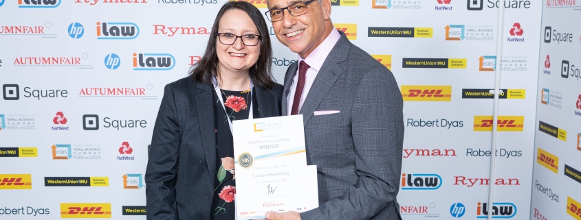 Photograph of Claire Saxton with Theo Paphitis receiving her SBS certificate