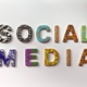 Social media written in different coloured and patterned letters to denote the changing statistics for 2023
