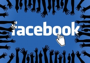 the facebook logo surrounded by shadow people to represent facebook groups
